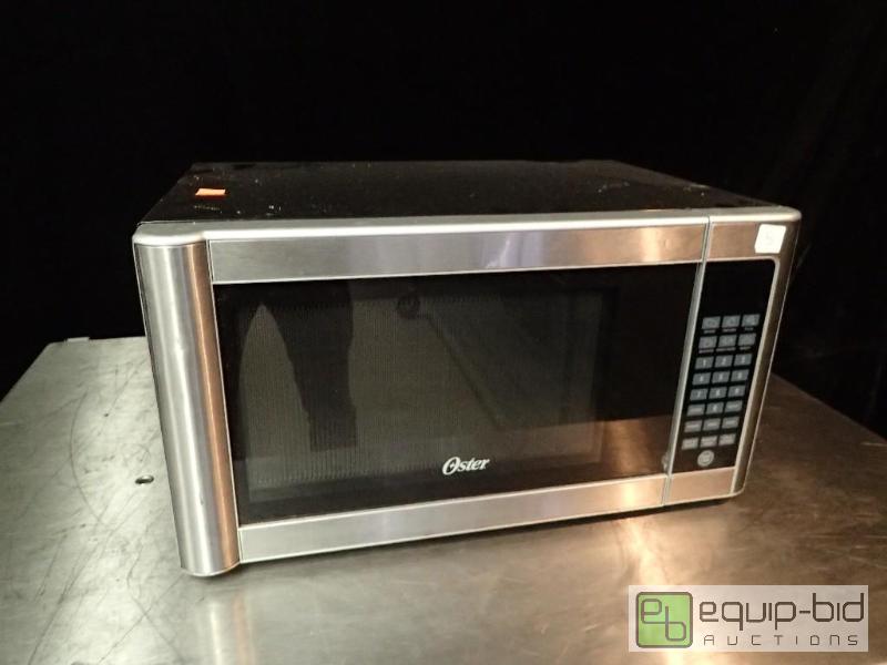 lot 9665 image: Oster Stainless Microwave