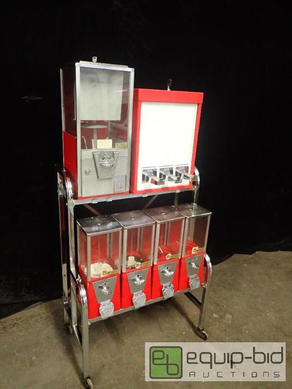 lot 802 image: 5 Head Toy and Candy Vending Machine with 3 Column Sticker Machine on Casters