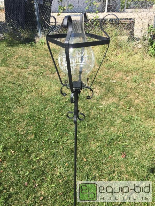 lot 55547 image: Very nice wrought iron yard candleholder with...