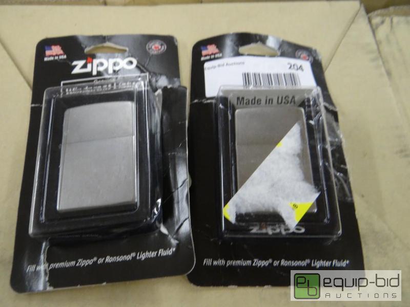 lot 204 image: Lot of 2 Zippo lighters in packages....