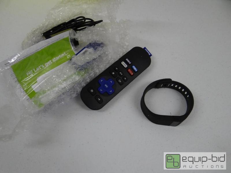 lot 372 image: Rocku streaming stick and Fitbit....