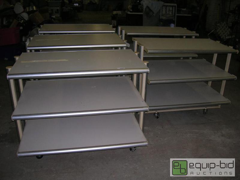 lot 661 image: Lot of Five 3 Tier Store Merchandise Racks on Wheels