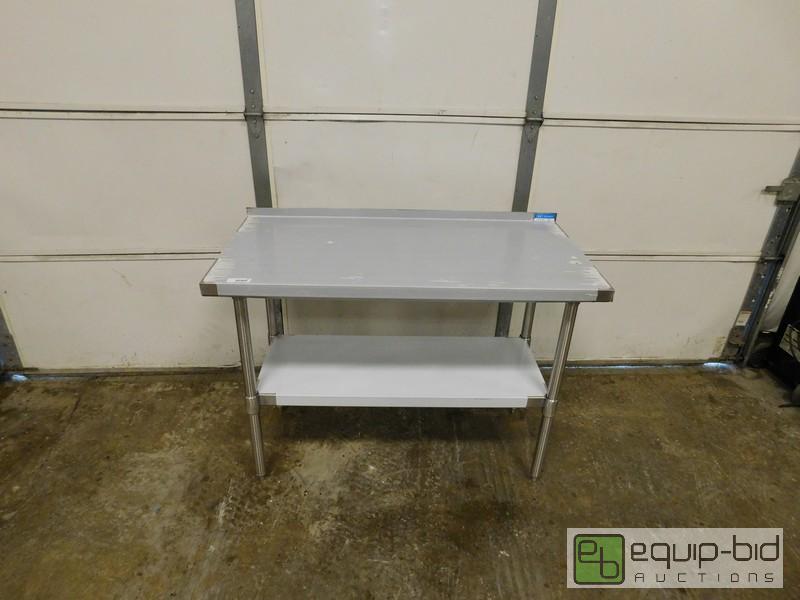 lot 434 image: New Scratch And Dent Completely Stainless Steel Table With Undershelf And Riser