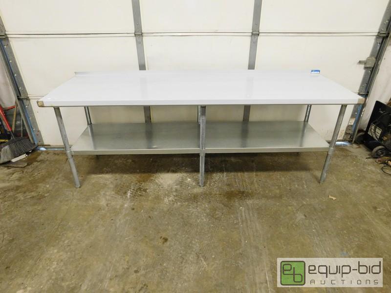 lot 438 image: New Scratch And Dent Stainless Steel Table With Undershelf And Riser