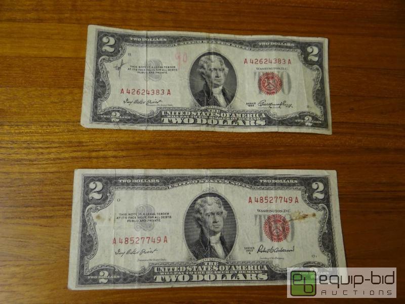 lot 1152 image: Lot of 2 red seal 2 dollar bills.  Both dated...
