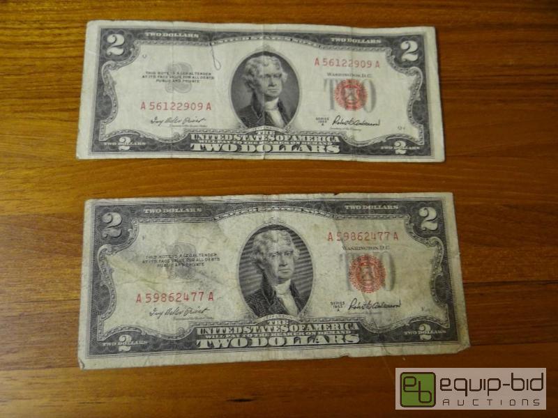 lot 1153 image: Lot of 2 red seal 2 dollar bills.  Both dated...