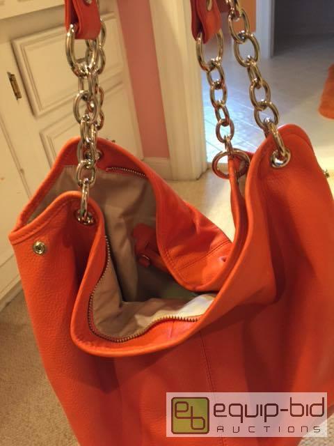 lot 1004 image: Brand New Orange Leather Designer Bodhi Purse