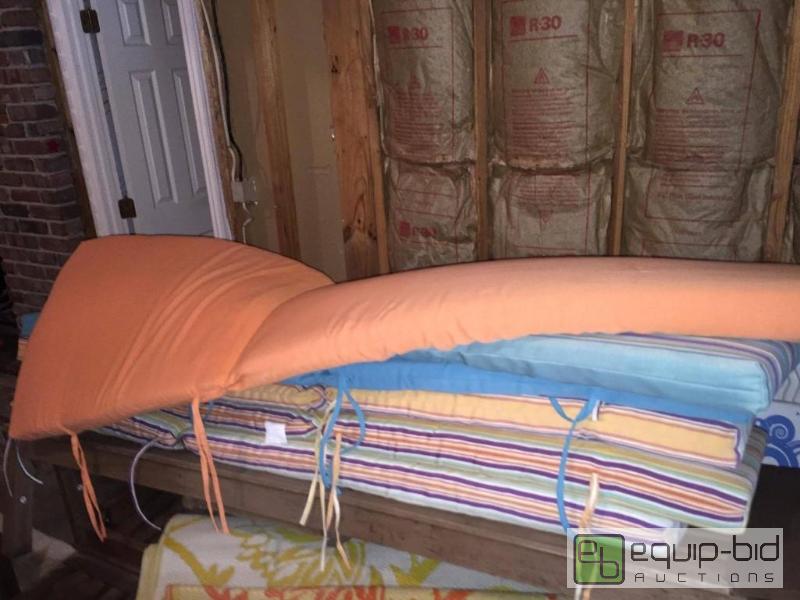 lot 124 image: Large Lot WORLD MARKET Patio Cushions, Hammock, Cecel Rug and pillows