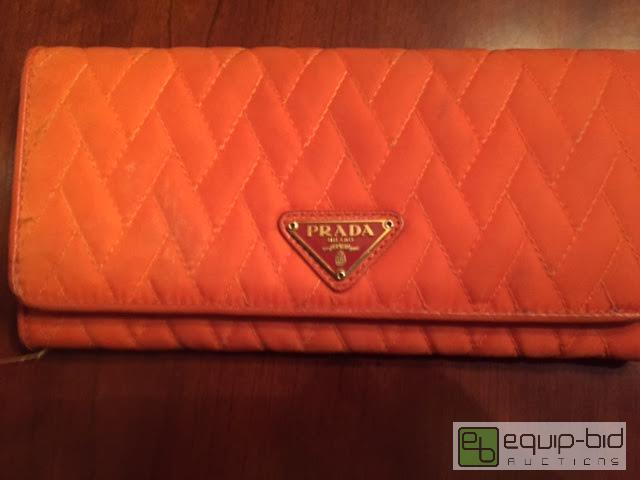 lot 185 image: Authentic PRADA Orange Clutch
