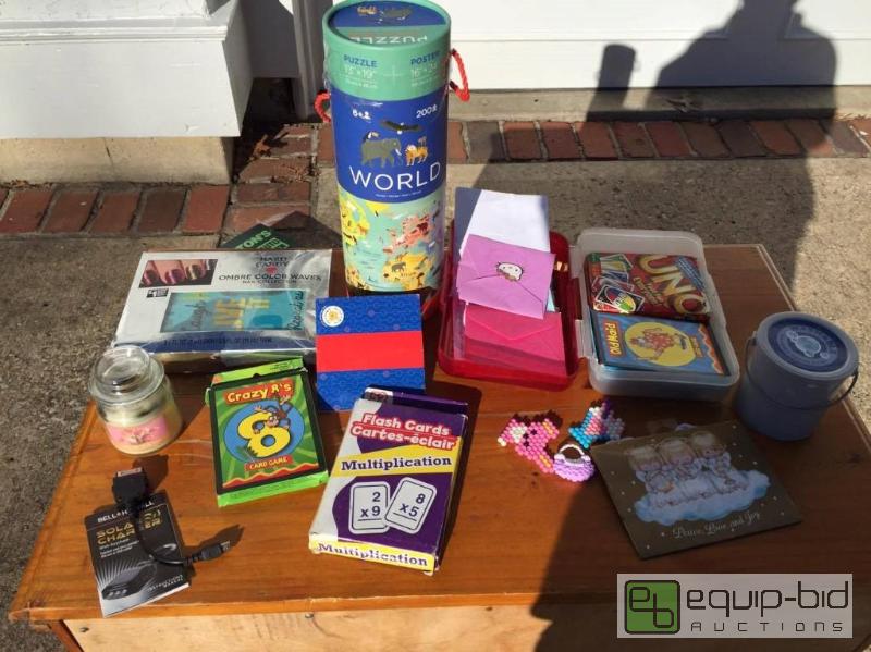 lot 188 image: Vanilla pop candle, Brand New Nail Kit, Flash Cards, Plastic Container, Solar Charger, Puzzle Poster