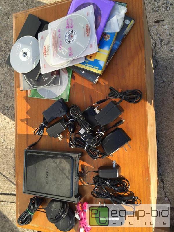 lot 199 image: Large lot Sony Headphones, Chargers, DvDs, Net Gear Wireless Router