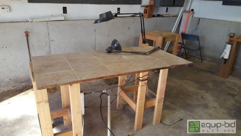 lot 1032 image: wooden shop table with lights and outlets