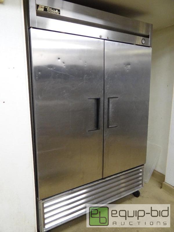 lot 565 image: True Solid 2 Door Reach in Refrigerator on Casters