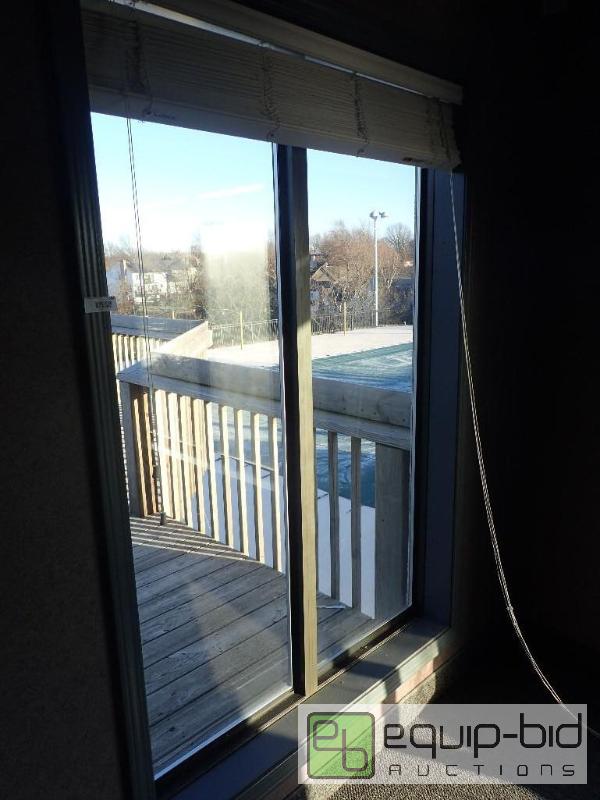 lot 584 image: (2) Double Glass Double Pane Pane Aluminum Frame Exterior Windows