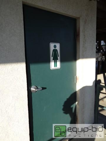 lot 650 image: 30x80 Steel Exterior Door With Ladies Room Sign