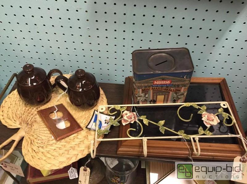 lot 68 image: Oak Frame Display Case, Wicker fan, Ceramic Coffee set, copper switch plate, and Nestle can