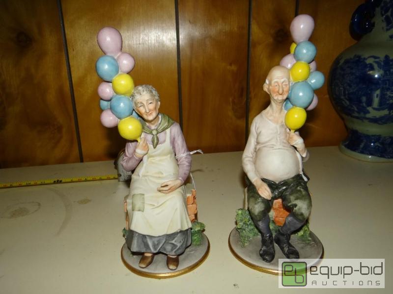 lot 1411 image: Old couple with balloons figurines.  Stamped ...