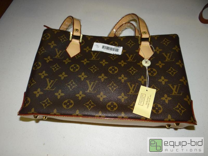 lot 1443 image: New with tags designer purse marked Louis Vui...