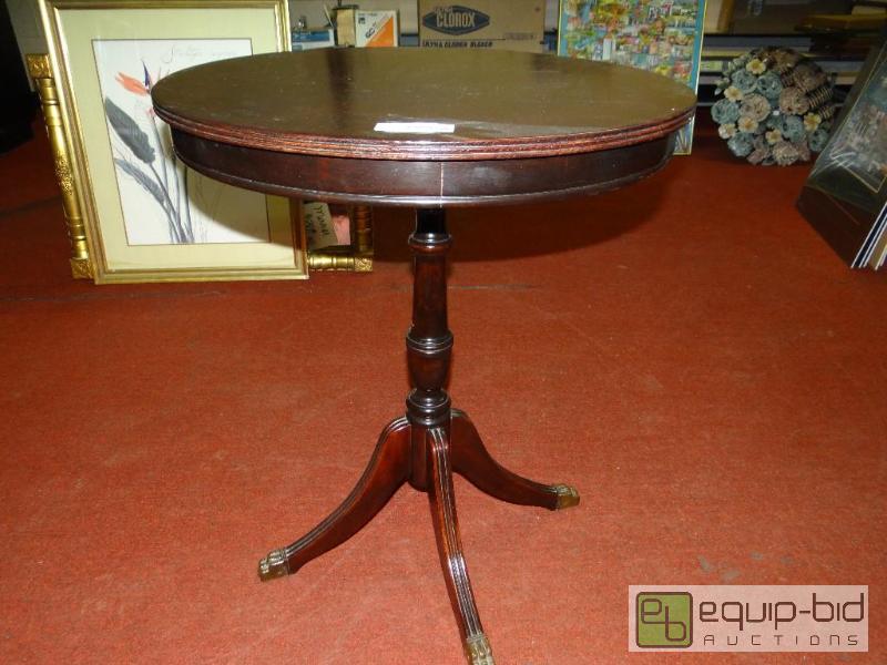 lot 1496 image: Vintage round lamp table with brass claw feet...