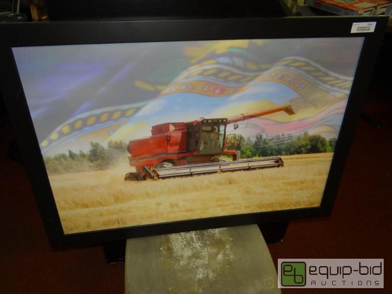 lot 1515 image: Large framed Kansas Wheat field and combine, ...