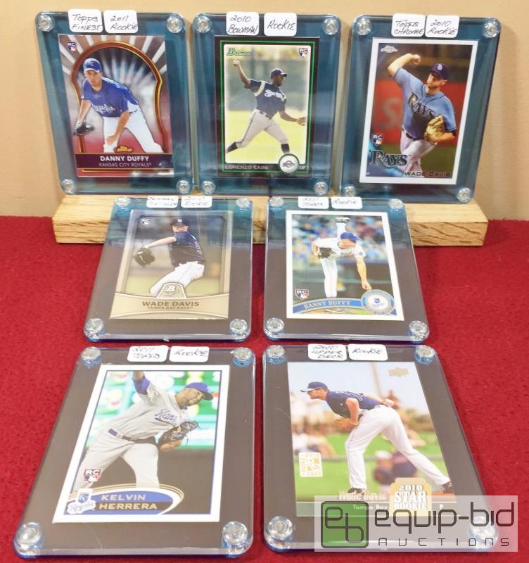 lot 1107 image: (7) ROYALS SUPERSTAR ROOKIES WROYAL BLUE ACRYLIC DISPLAY HOLDERS - CAIN - DAVIS - DUFFY - HERRERA