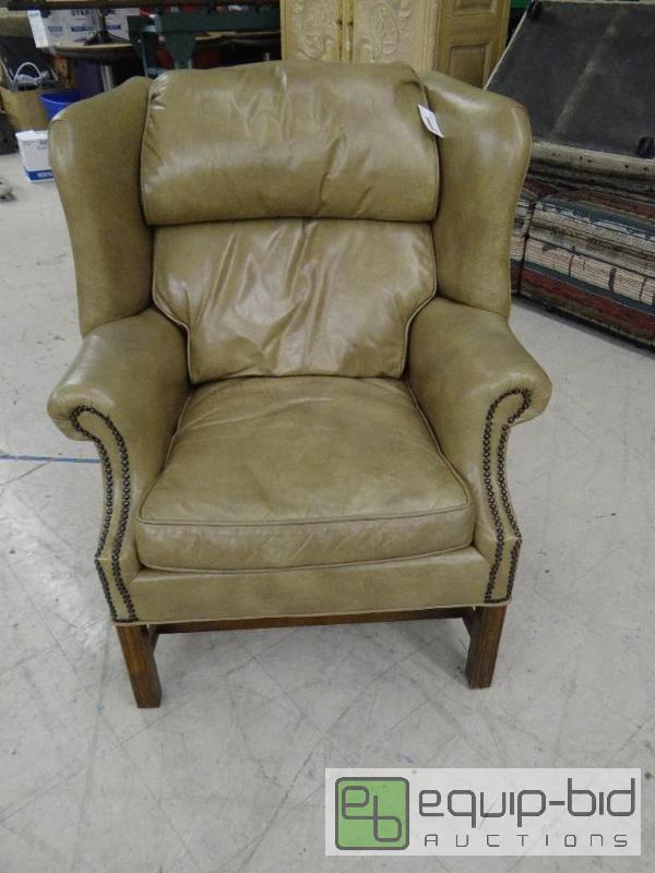 lot 1580 image: High end leather chair with nail head accents...