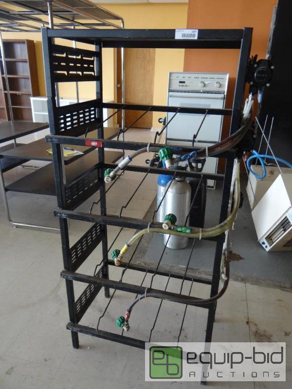 lot 1607 image: Bag in the box rack with 5 flo jet pumps....
