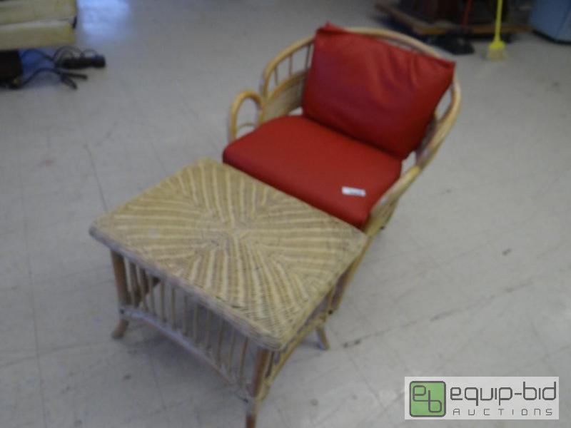 lot 1620 image: Wicker chair on wheels with wicker end table....