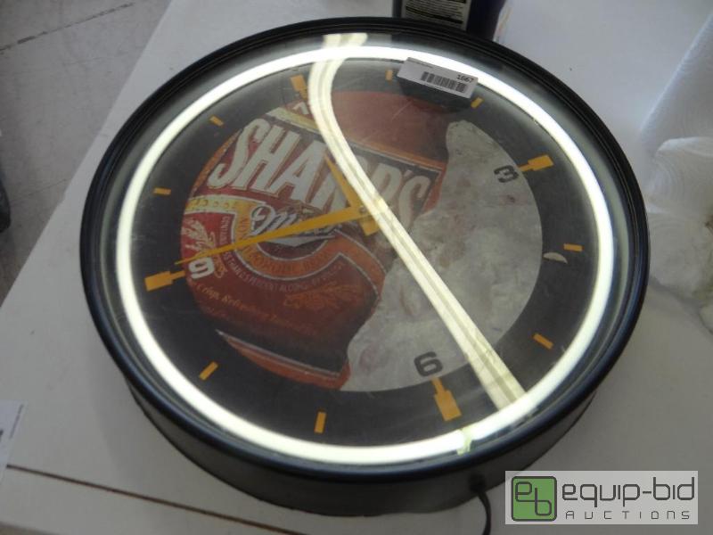 lot 1667 image: Neon Miller clock....