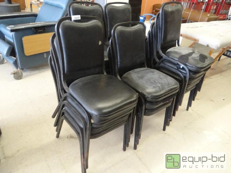 lot 1677 image: Lot of 20 black padded stacking chairs....