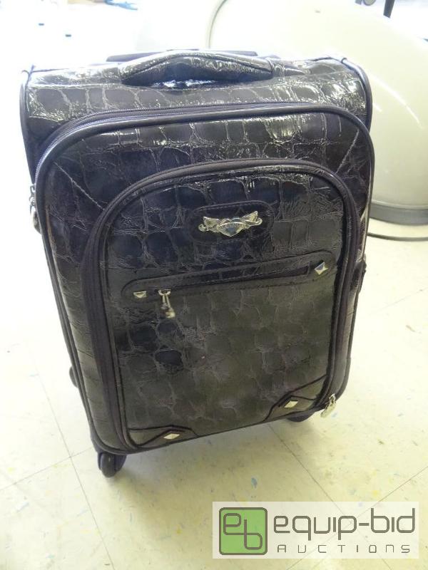 lot 1687 image: Kathy Van Zeeland purple suitcase on wheels w...