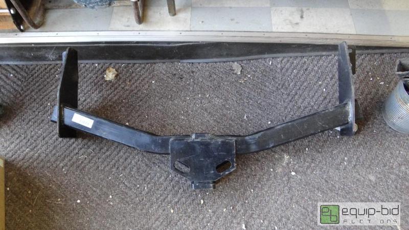 lot 476 image: Mid 90s trailer hitch and bucket of parts....