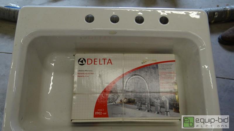 lot 1056 image: Kohler Cast Iron Sink And Delta Faucet