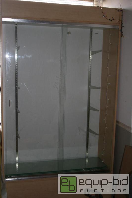 lot 2047 image: Glass front display case with glass shelves. ...