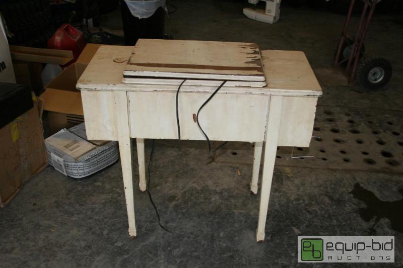 lot 2059 image: Antique sewing machine table with antique sin...