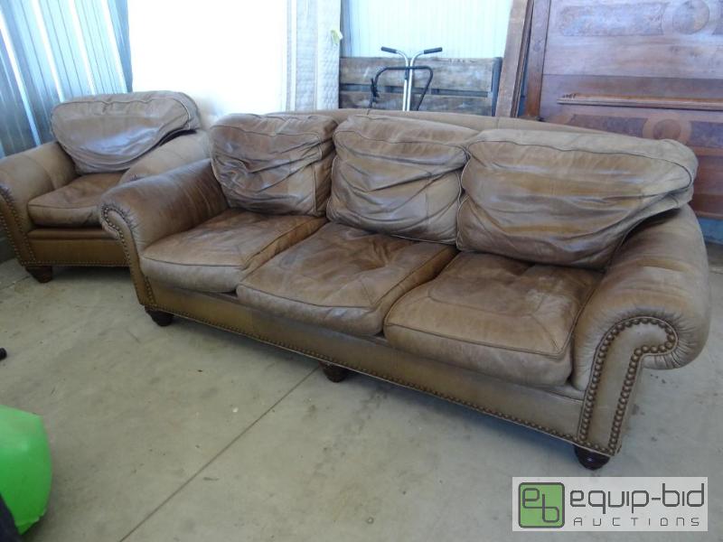 lot 599 image: Leather couch, chair set with nail head trim....