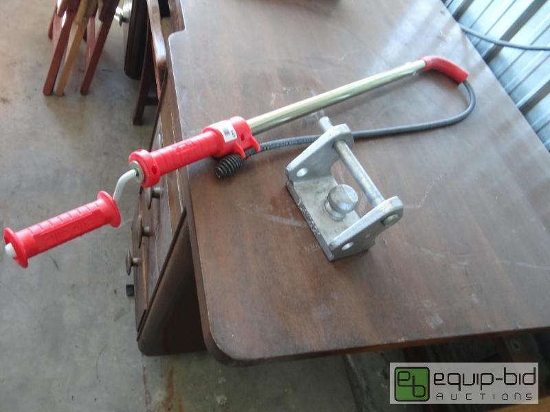 lot 647 image: Rigid sewer snake and trailer lock....