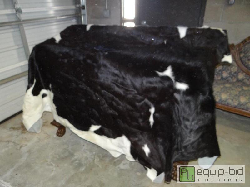 lot 659 image: Full size black and white cow hide rug....