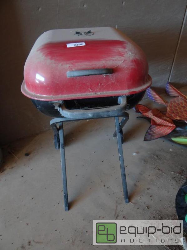 lot 671 image: Folding BBQ grill on wheels....
