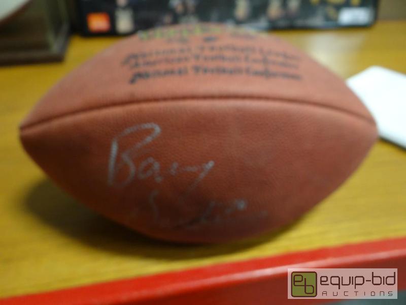 lot 677 image: Wilson football signed Barry Sanders....