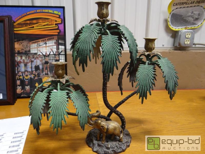 lot 681 image: Very heavy metal palm tree candle holder.  Re...