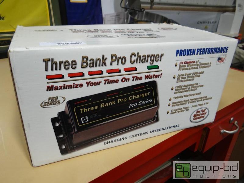 lot 709 image: New in box pro series three bank pro charger....
