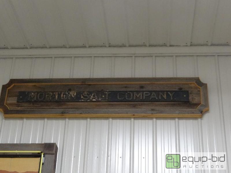 lot 730 image: Vintage metal Morton Salt Company sign on bar...