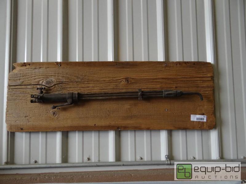 lot 732 image: Vintage cutting torch on old wood mount....
