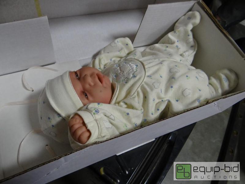 lot 867 image: Very real looking baby doll in box....
