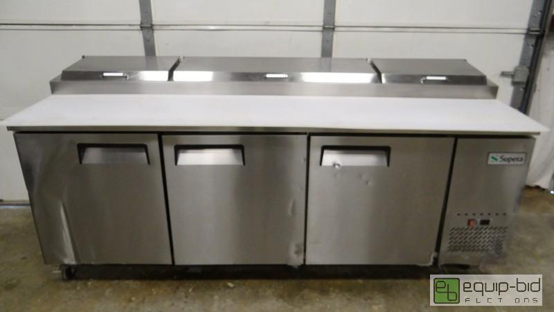 lot 123 image: New 93 Supera 3 Door Refrigerated Pizza Prep Table With Damage