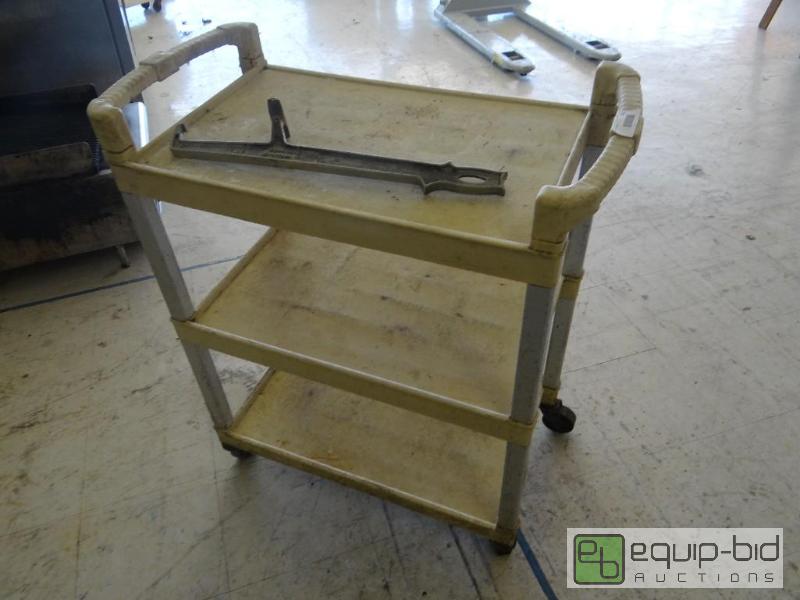 lot 551 image: Bus cart on wheels and bucket opener....