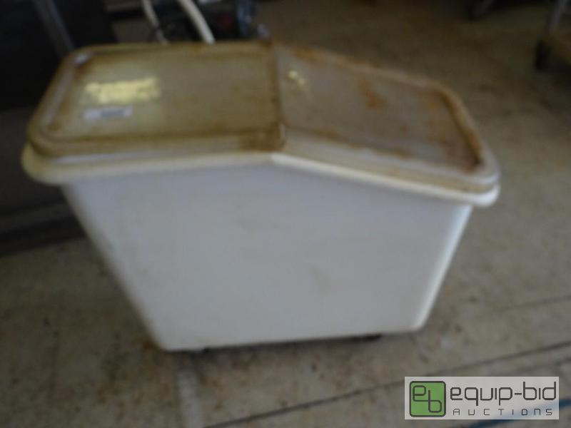 lot 555 image: Ingredient bin on wheels with lid....