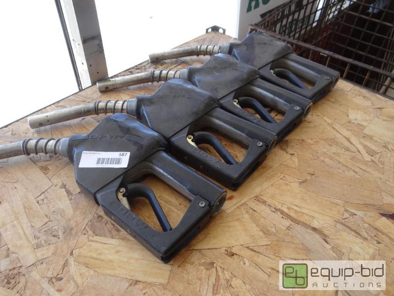 lot 587 image: Lot of 4 gas pump nozzles....