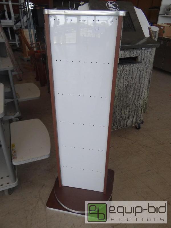 lot 611 image: Double sided reading glass display rack.  Flo...